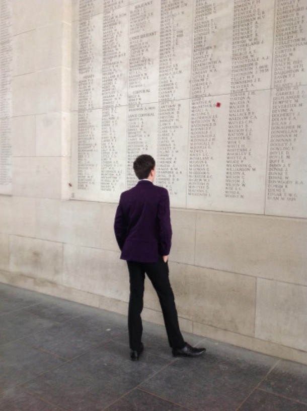 Image of School kid looking at list of fallen soldier's names