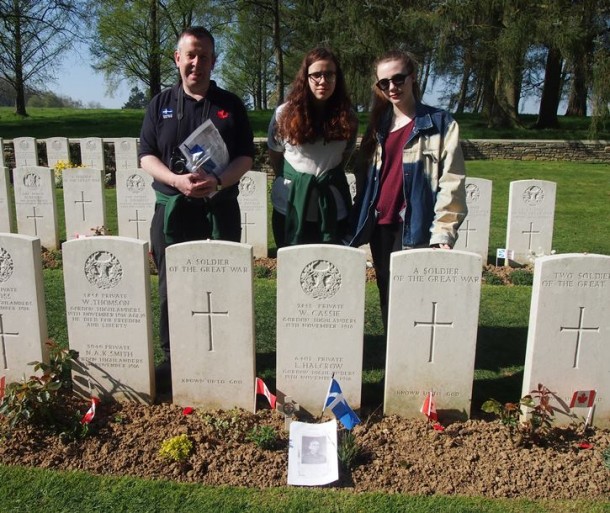 Holly Mouat and Carys Nield with history teacher John Sandison at Y Ridge Cemetery